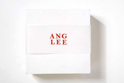 image of white wooden box with red type